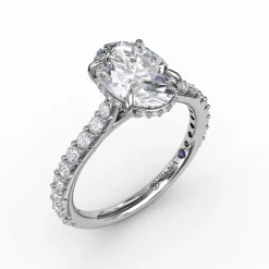 Classic Oval Diamond Solitaire Engagement Ring With Hidden Pavé Halo