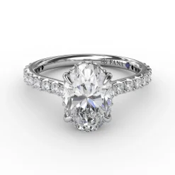Classic Oval Diamond Solitaire Engagement Ring With Hidden Pavé Halo