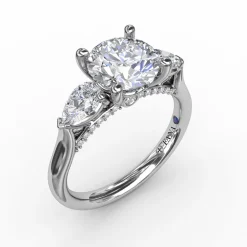 Classic Three-Stone Engagement Ring With Pear-Shape Side Diamonds