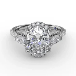 Oval Diamond Halo Engagement Ring With Pear-Shape Diamond Side Stones